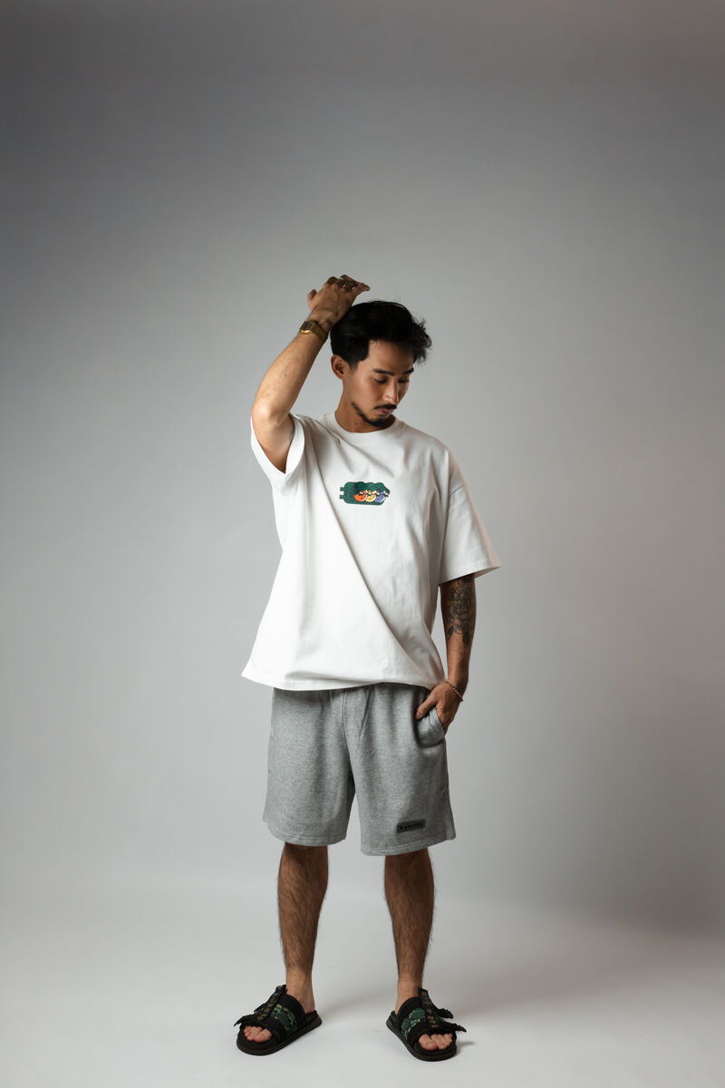 The Kiko — small mascot chest hit tee, White colorway, full body studio