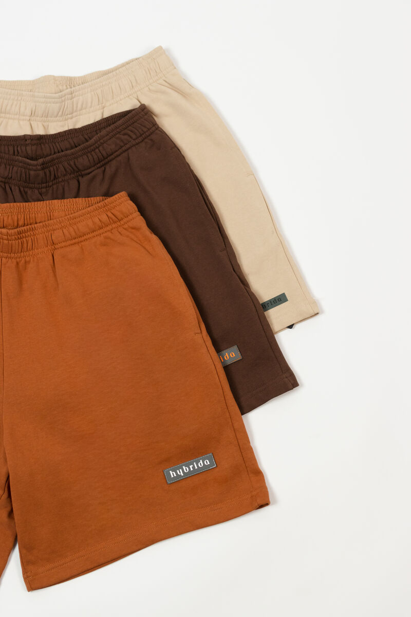 Hybrida shorts colorway stack — bone, coffee, rust