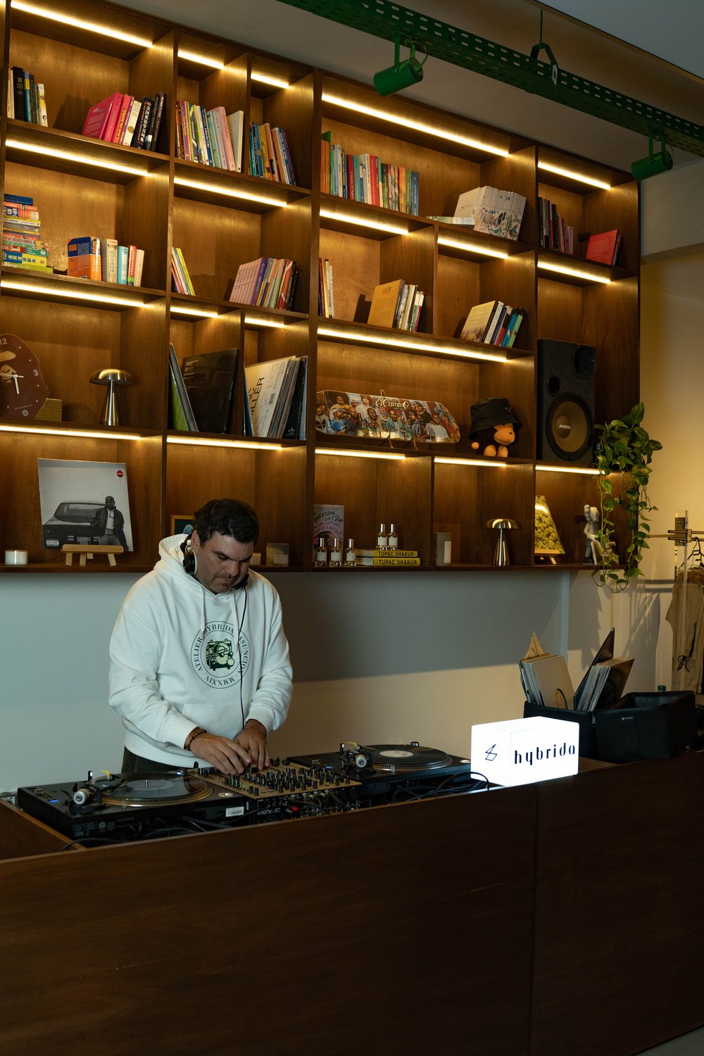 DJ behind the HYBRIDA LAB counter during HQ Sessions