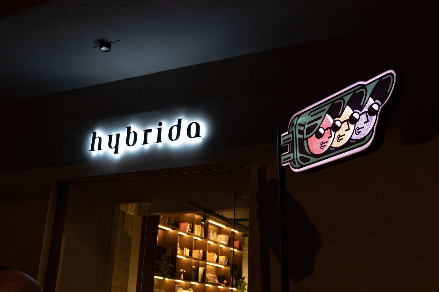 HYBRIDA LAB exterior sign and KIKO light at night